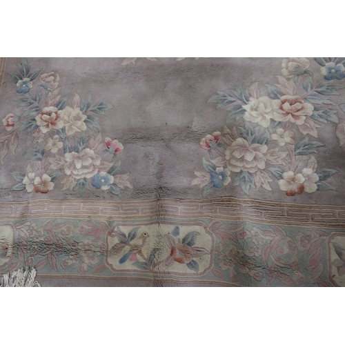 585 - A Chinese contour pile carpet with all-over traditional floral design on a mushroom ground, 84” x 12... 