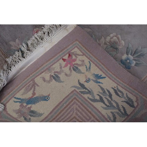 585 - A Chinese contour pile carpet with all-over traditional floral design on a mushroom ground, 84” x 12... 