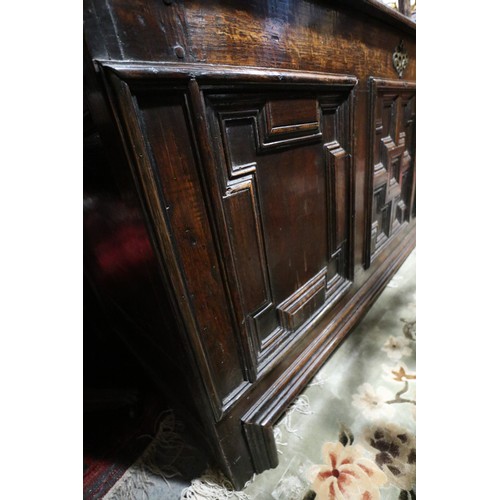 408 - An 18th century three fielded panel front coffer, 54