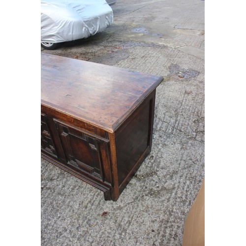 408 - An 18th century three fielded panel front coffer, 54