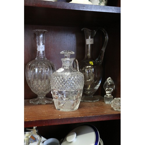 17 - A cut glass claret jug, a cut glass decanter and stopper, and one other claret jug