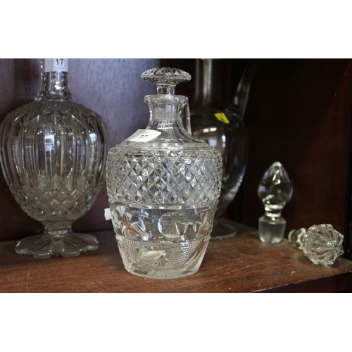 17 - A cut glass claret jug, a cut glass decanter and stopper, and one other claret jug