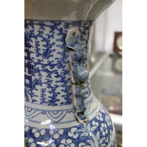 190 - A pair of late 19th century Chinese blue and white porcelain two-handled vases with symbol and scrol... 