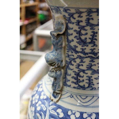 190 - A pair of late 19th century Chinese blue and white porcelain two-handled vases with symbol and scrol... 