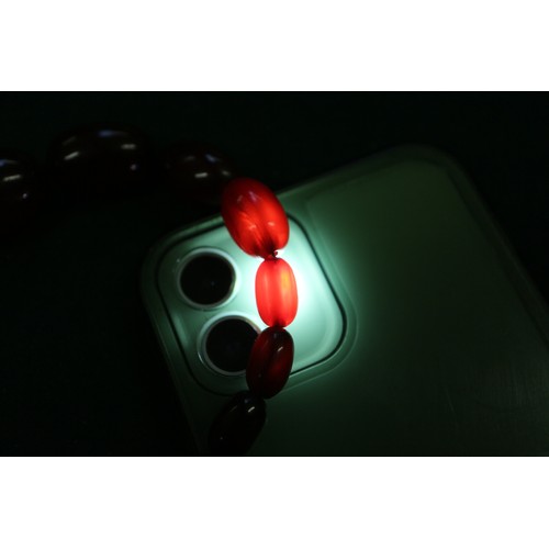 302 - A cherry amber Bakelite bead necklace, the largest oval bead, 34mm long, 71.6g gross, and another si... 