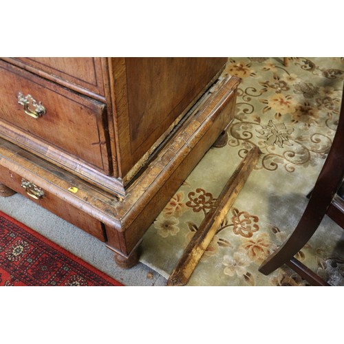 443 - An early 18th century figured walnut and banded chest on stand, the upper section fitted two small d... 