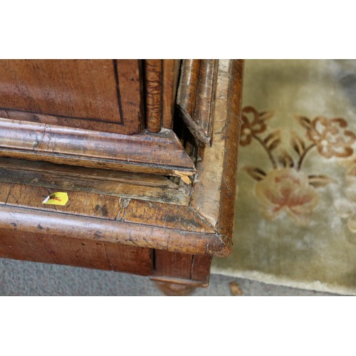 443 - An early 18th century figured walnut and banded chest on stand, the upper section fitted two small d... 