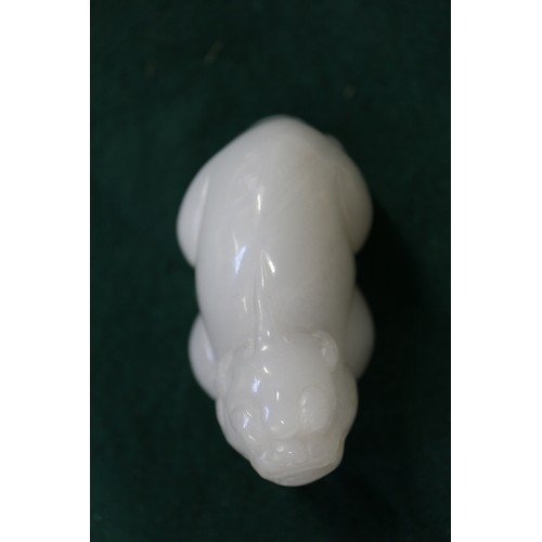 67 - A Chinese carved pale jade model of a mythical beast, 2 3/4