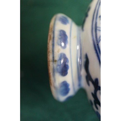 59 - A Chinese porcelain blue and white moon flask with all-over geometric and scroll decoration, 8