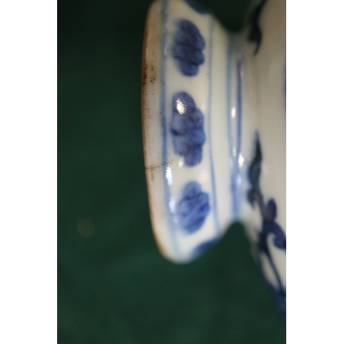 59 - A Chinese porcelain blue and white moon flask with all-over geometric and scroll decoration, 8