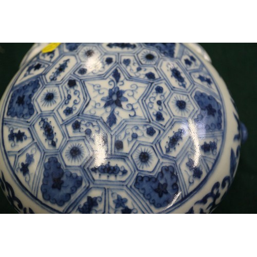 59 - A Chinese porcelain blue and white moon flask with all-over geometric and scroll decoration, 8