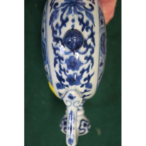 59 - A Chinese porcelain blue and white moon flask with all-over geometric and scroll decoration, 8