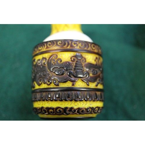 70 - A Chinese Peking glass snuff bottle with scrolled and bat decoration, 3 3/4