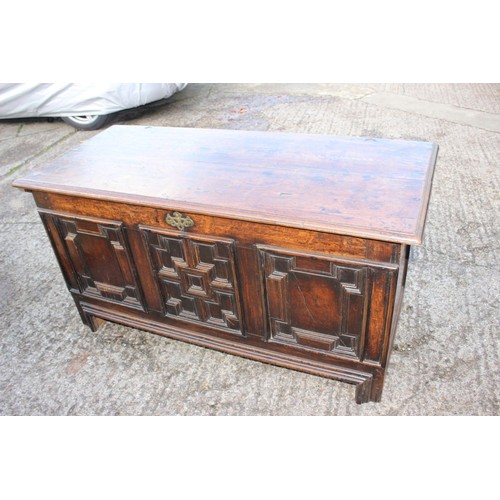 275 - An 18th century three fielded panel front coffer, 54