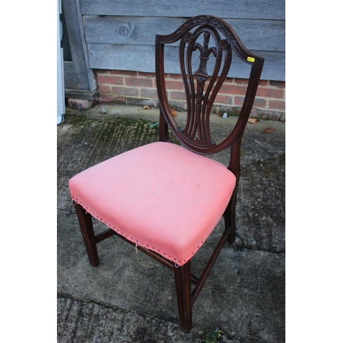 250 - A late Georgian carved mahogany side chair of Hepplewhite design with stuffed over seat, on moulded ... 