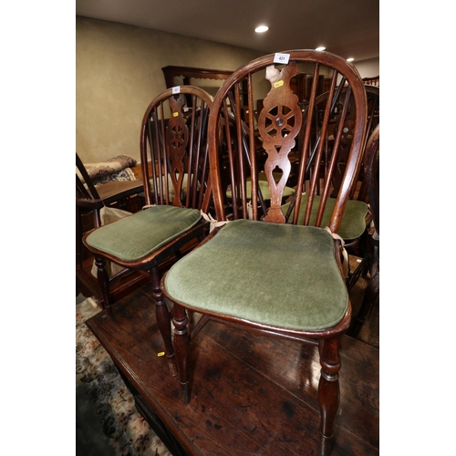 258 - A Harlequin set of five 19th century Windsor wheelback chairs with elm panel seats, on turned and st... 