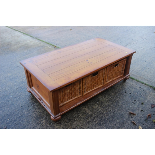 298 - A waxed pine low coffee table, fitted three basket drawers, 50