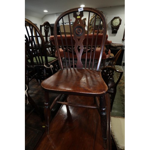 259 - A pair of 19th century Windsor star and spindle back dining chairs with elm panel seats, on turned a... 