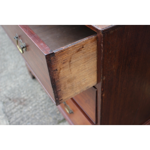 252 - A Georgian mahogany and inlaid chest of three long graduated drawers, on bracket supports, 41