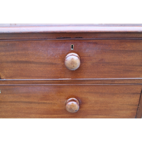 264 - A mid 19th century mahogany chest of two short and three long graduated drawers with knob handles, o... 