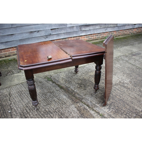 285 - A Victorian oak and mahogany rectangular top wind-out dining table with one extra leaf, on reeded an... 