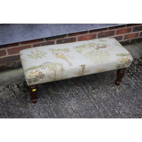 303 - A modern rectangular footstool, upholstered in an African themed fabric, and a 1960s nest of occasio... 