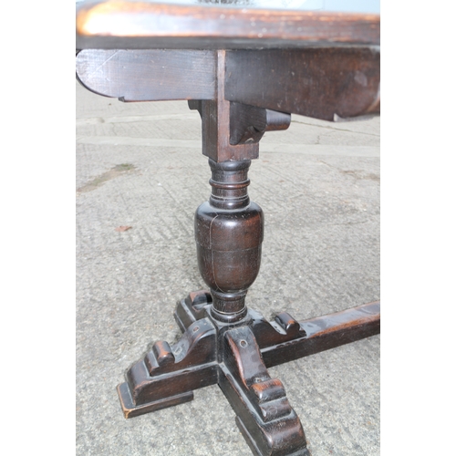 326 - An oak refectory style table, on bulbous turned supports, 60