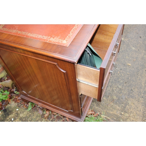 347 - A reproduction twin pedestal desk with tooled leather top over nine drawers, on bracket supports, 47... 