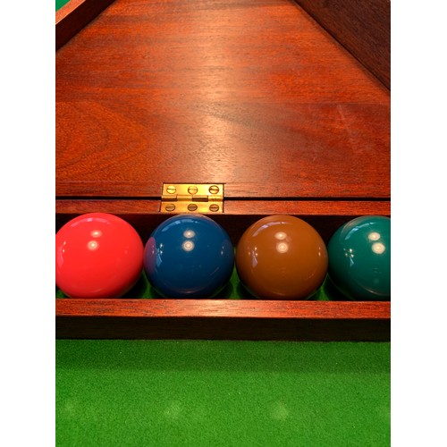 261 - A Cox and Yemen late Victorian mahogany billiard table, on faceted supports, complete with cues, res... 