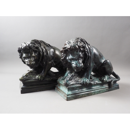 106 - A pair of patinated brass lion doorstops with wild boar, 8