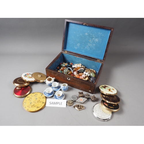 145 - A number of lady's powder compacts, a doll's teaset, a group of figure decorated pill boxes and a sm... 