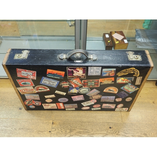 148 - A Karl Baisch leather bound car trunk, decorated numerous travel stickers, 34