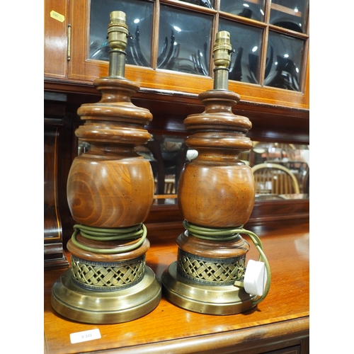 160 - A pair of polished as walnut and brass mounted table lamps, 18