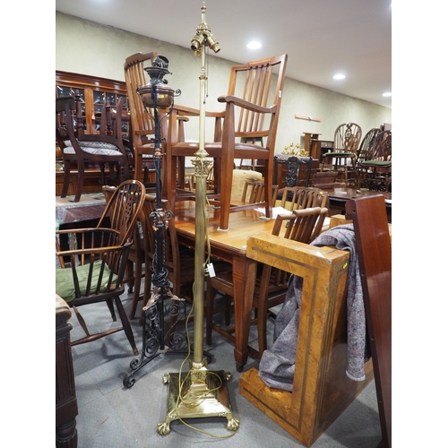 161 - An Edwardian brass adjustable standard lamp with reeded column and square base with ball and claw su... 