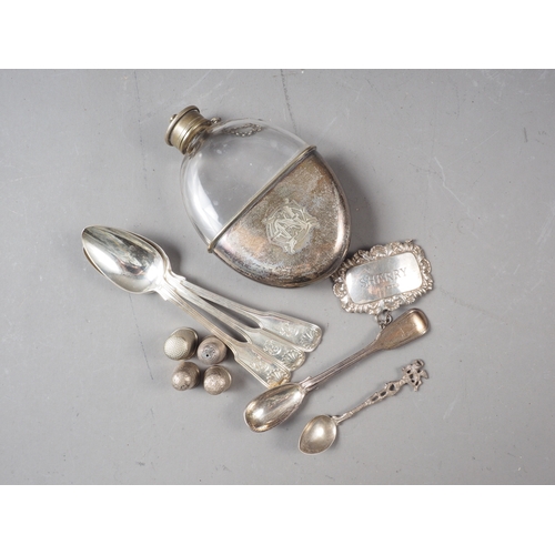 175 - A Georgian silver condiment spoon, three silver thimbles, a silver decanter label and a silver mount... 