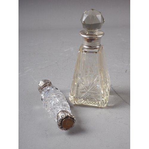 181 - A cut glass and silver mounted double-ended scent bottle, and another similar scent bottle and stopp... 