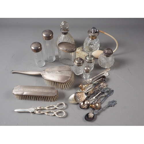 182 - Four silver mounted toilet jars, a silver mounted scent spray, two silver backed hairbrushes, etc