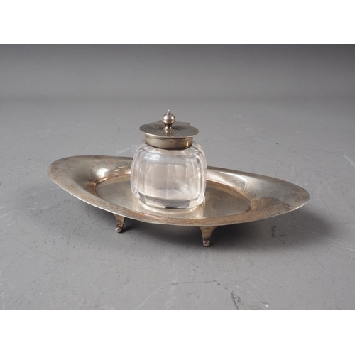 184 - An oval silver desk stand with cut glass inkwell, 1.9oz troy approx