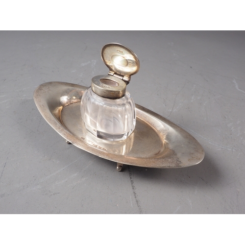 184 - An oval silver desk stand with cut glass inkwell, 1.9oz troy approx