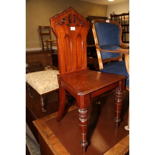 267 - A late Victorian carved mahogany hall chair, on turned supports