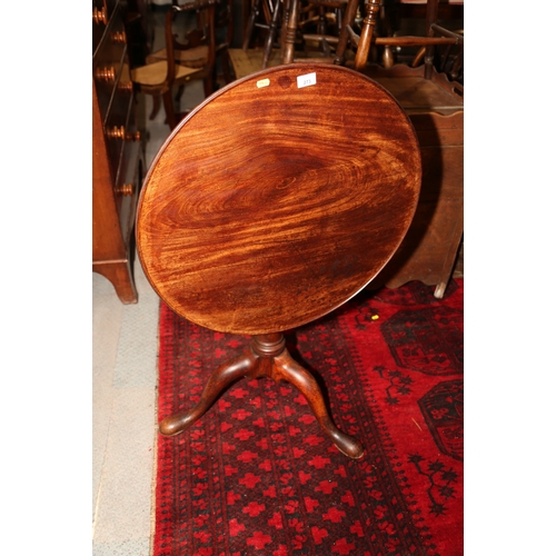 273 - A Georgian mahogany circular tilt top centre table with bird cage, on canon barrel turned column and... 