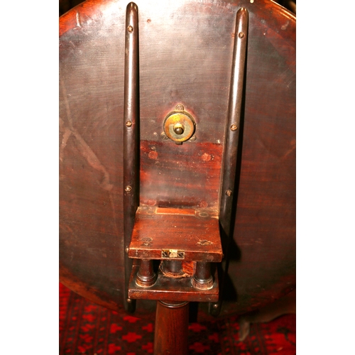 273 - A Georgian mahogany circular tilt top centre table with bird cage, on canon barrel turned column and... 