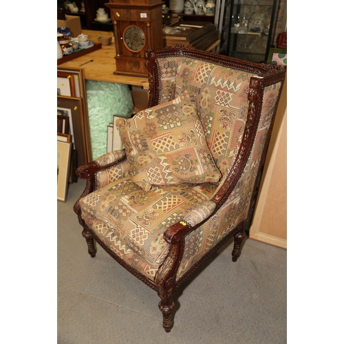 277 - A French carved and painted open armchair, upholstered in a patterned fabric, on turned and carved s... 