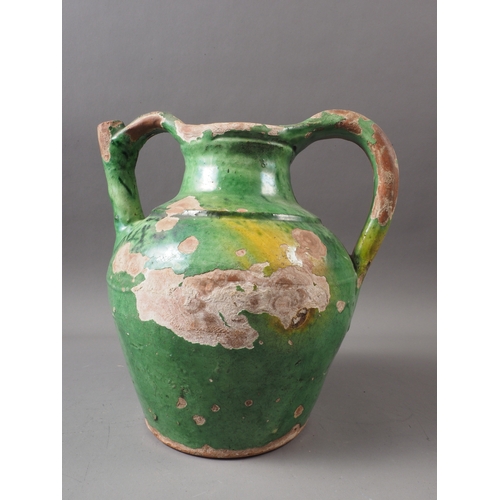 28 - An early 19th century green and yellow glazed jug, 10