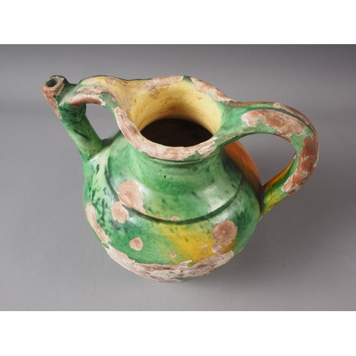 28 - An early 19th century green and yellow glazed jug, 10