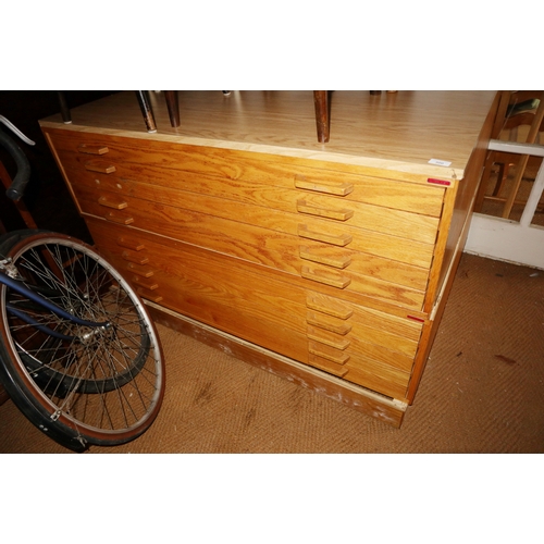 300 - A modern light oak plan chest, fitted ten drawers, on block base, 53