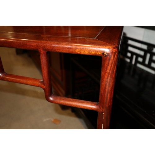 307 - A Chinese hardwood console table, on slender turned supports, 38