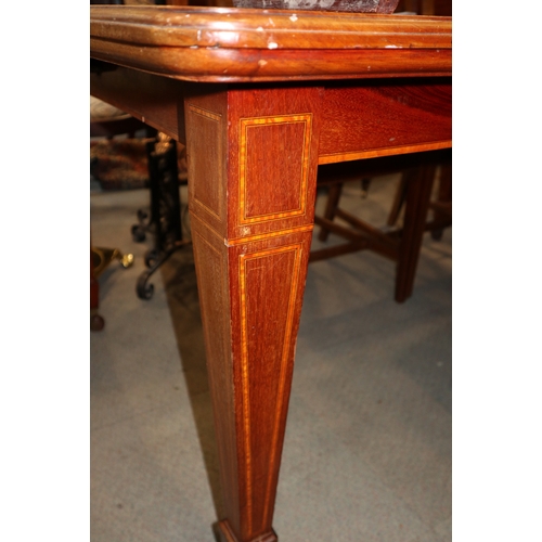 328 - An Edwardian mahogany and satinwood inlaid extending dining table with two extra leaves, on square t... 