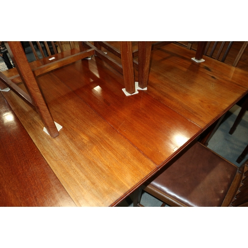 328 - An Edwardian mahogany and satinwood inlaid extending dining table with two extra leaves, on square t... 