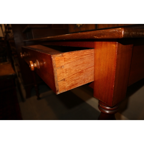 335 - A mahogany side table, fitted two drawers, on turned supports, 48